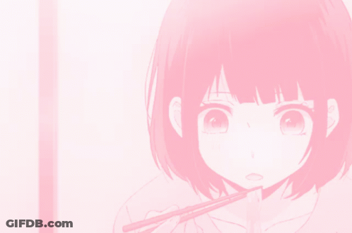 A Girl With Short Pink Hair Is Eating With Chopsticks GIF