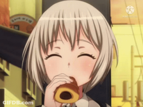 A Girl With Short White Hair Is Eating A Donut And Smiling For The Camera GIF
