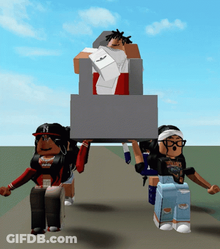 A Girl With The Letter N On Her Hat Is Holding A Large Box GIF