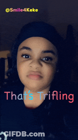 A Girl With The Words That 'S Trifling Written On Her Face GIF