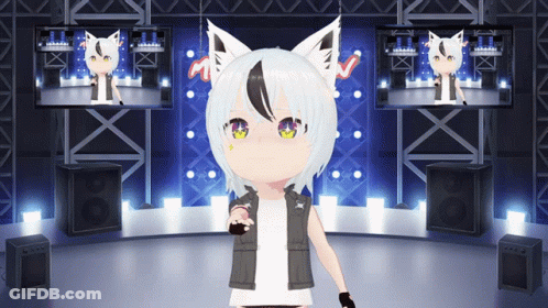 A Girl With White Hair And Black Ears Is Standing On A Stage In Front Of Two Monitors GIF