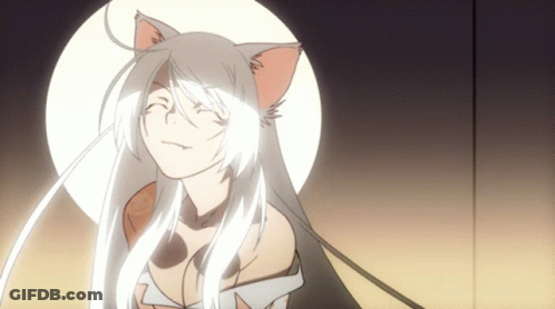 A Girl With White Hair And Cat Ears Looks At The Camera GIF