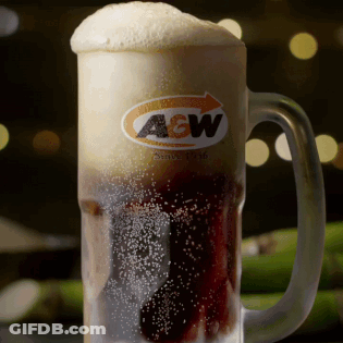 A Glass Mug Of A & W Beer With Foam On Top GIF