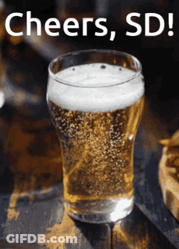 A Glass Of Beer With Cheers Sd Written On The Bottom GIF