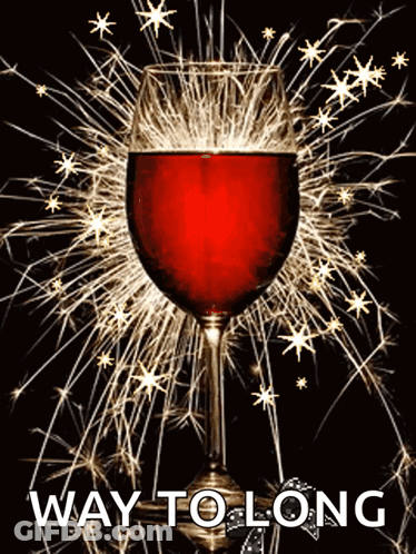 A Glass Of Red Wine Is Surrounded By Sparklers And The Words Way To Long Are Below It GIF