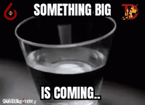 A Glass Of Water With A Caption That Says Something Big Is Coming . GIF