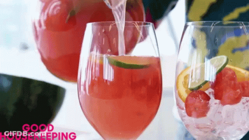 A Glass Of Watermelon Juice Is Being Poured From A Pitcher GIF