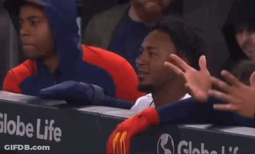 A Globe Life Sign Is Behind A Man GIF