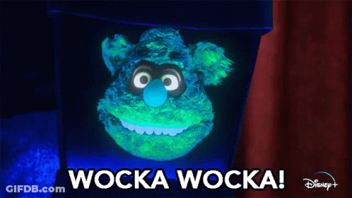 A Glow In The Dark Stuffed Animal With The Words Wocka Wocka On The Bottom GIF
