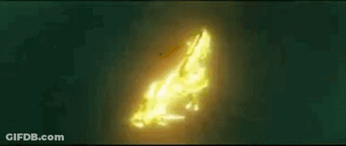 A Glowing Object Is Floating In The Dark . GIF