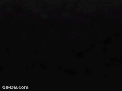 A Glowing Red Symbol On A Dark Background GIF
