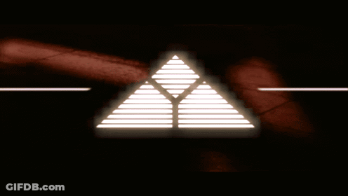 A Glowing Triangle With A Red Background GIF