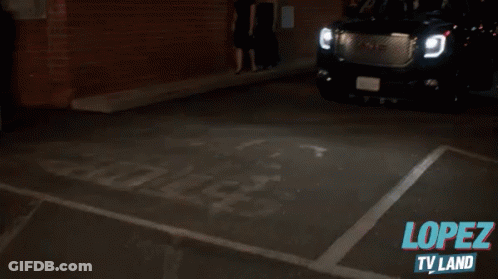 A Gmc Suv Is Parked In A Dark Parking Lot With The Words Lopez Tv Land Written On The Bottom GIF