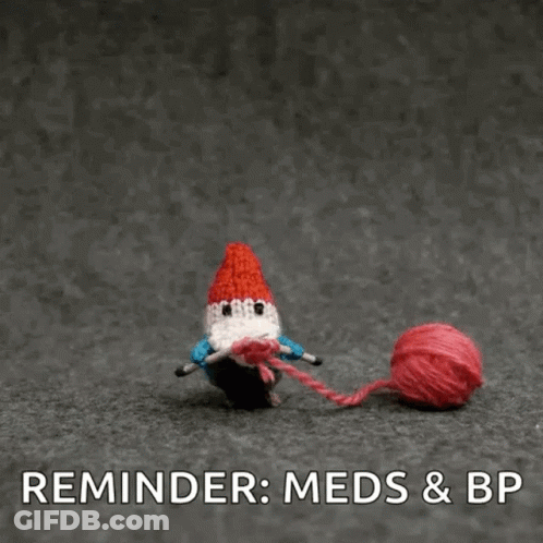 A Gnome Is Holding A Ball Of Yarn With The Words Reminder : Meds & Bp Below It . GIF