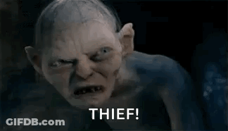 A Goblin From The Lord Of The Rings Is Looking At The Camera And Says Thief . GIF