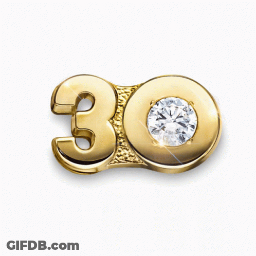 A Gold Number 30 With A Diamond On It GIF
