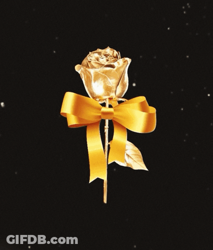 A Gold Rose With A Yellow Ribbon On It GIF