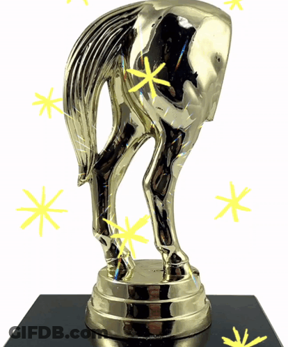 A Gold Trophy With A Horse 'S Butt On It GIF