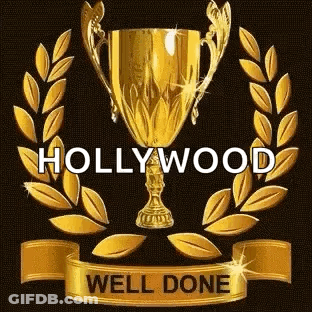 A Gold Trophy With A Laurel Wreath Around It And A Ribbon That Says `` Hollywood Well Done '' . GIF