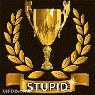 A Gold Trophy With A Laurel Wreath Around It And A Ribbon That Says Stupid On It . GIF
