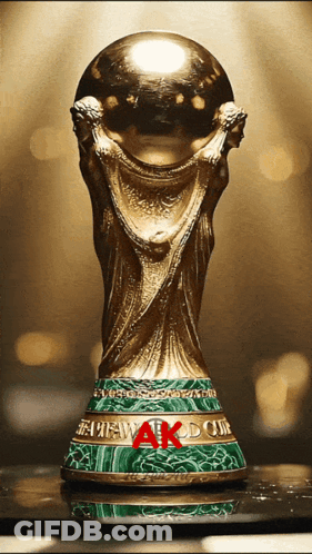 A Gold Trophy With The Word Ak On The Base GIF