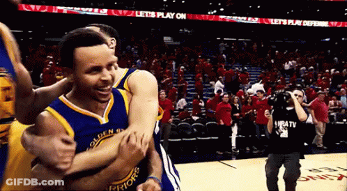 A Golden State Warriors Player Is Being Hugged By Another Player GIF