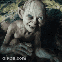 A Gollum From The Lord Of The Rings Is Smiling GIF
