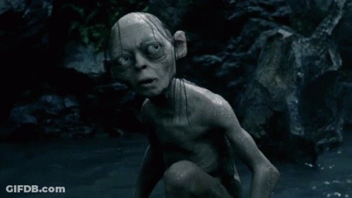 A Gollum Is Crawling In The Water And Looking At The Camera With A Surprised Look On His Face GIF