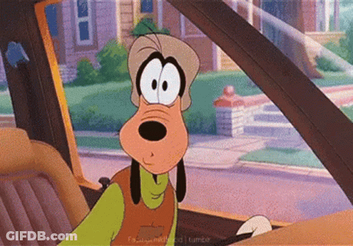 A Goofy Cartoon Character Is Driving A Car GIF