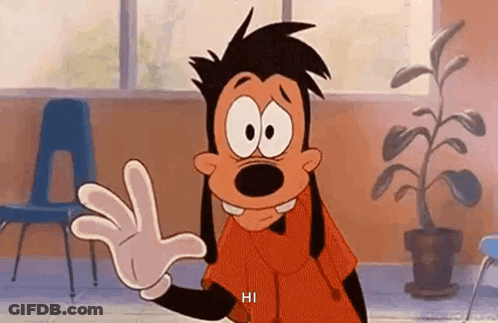 A Goofy Cartoon Character Is Waving His Hand In A Classroom . GIF
