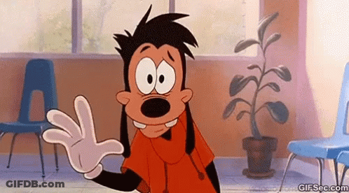 A Goofy Cartoon Character Is Waving His Hand In A Room With Chairs . GIF