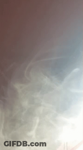 A Gray Background With A Few Lines Of Smoke On It GIF