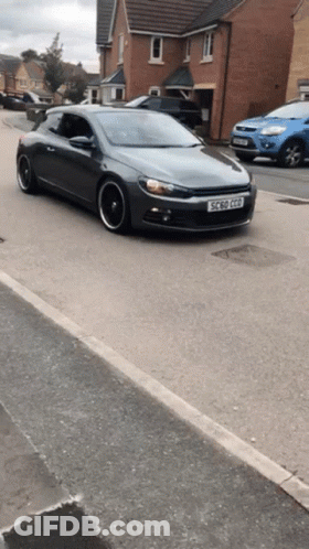 A Gray Car With A License Plate That Says Ec 50 Gpd GIF