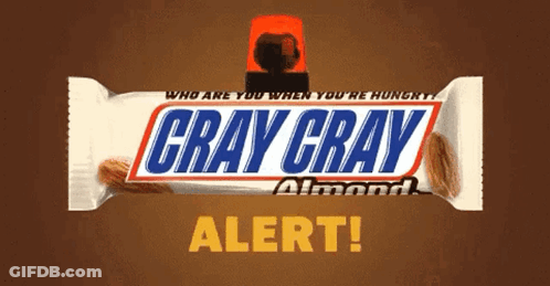 A Gray Gray Almond Snickers Bar With A Red Light On Top GIF