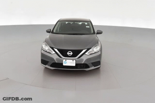 A Gray Nissan Car With A License Plate That Says Iowa On It GIF