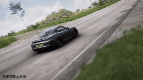 A Gray Sports Car With A License Plate That Says Tfs - Lm - A Driving Down A Road GIF