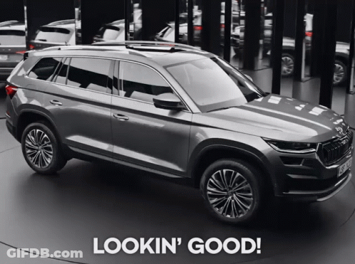 A Gray Suv With The Words Lookin ' Good Written On The Bottom GIF