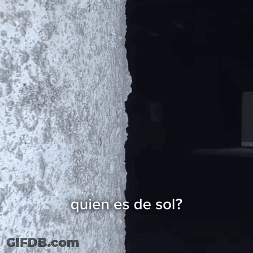 Gray Wall With Quien Es De Sol Text GIF