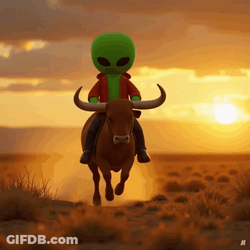 A Green Alien Is Riding A Bull In The Desert At Sunset GIF