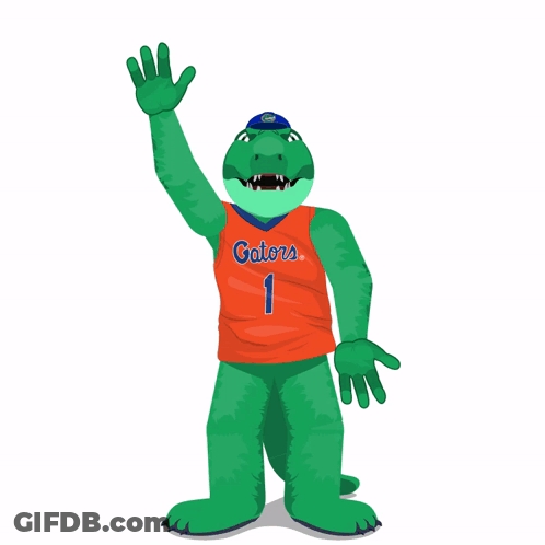 A Green Alligator Wearing An Orange Gators Jersey Is Waving GIF