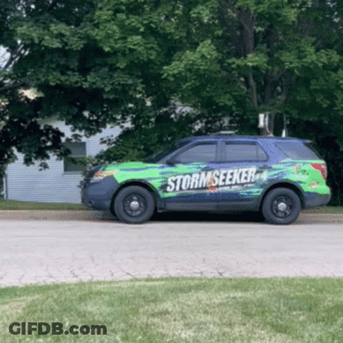 A Green And Black Suv With The Word Storm Seeker On The Side GIF