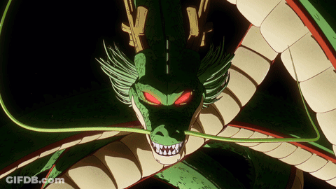 A Green And White Dragon With Red Eyes GIF