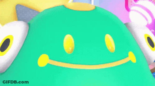 A Green And Yellow Cartoon Character With A Big Smile On His Face GIF
