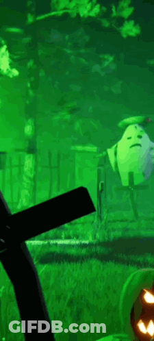 A Green Background With A Pumpkin In The Foreground And A Windmill In The Background . GIF