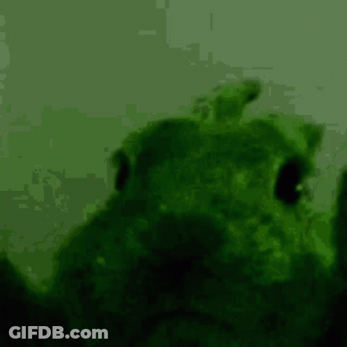 A Green Background With A Silhouette Of A Person In The Foreground GIF