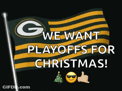 A Green Bay Packers Flag With The Words " We Want Playoffs For Christmas " Written On It GIF