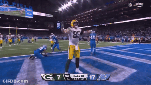 A Green Bay Packers Football Player Celebrates A Touchdown GIF