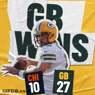 A Green Bay Packers Football Player Is Holding A Ball GIF