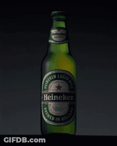 A Green Bottle Of Heineken Lager Beer Brewed In Holland GIF