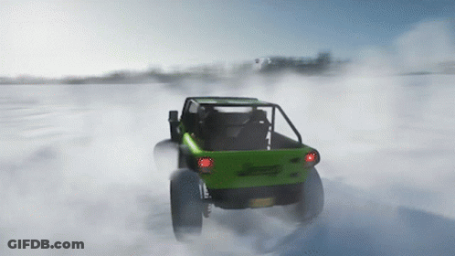 A Green Buggy Is Driving Through The Snow With A License Plate That Says ' A ' GIF